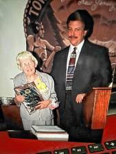 Mary Michalka, who with her husband, John, opened West Milford’s first pharmacy nearly 75 years ago, with Mayor Phil Weisbecker in 2000. She was honored as a Lifetime West Milford Volunteer. (Photo courtesy of Ann Genader)