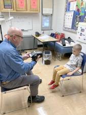 The West Milford Lions Club uses a Welch/Allyn Vision Screener to test children’s eyesight.