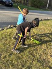 Cub Scout Pack 139 of Apshawa Elementary School do spring cleanups for two families in their community. (Photos provided)