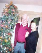 June and Frank Fincken took special pride in the old-fashioned Christmas tree they decorated each year when they lived at Kitchell Lake in West Milford. Frank literally painstakingly spent many days hanging each piece of foil “rain” every year. The couple is seen with their tree in 2003.