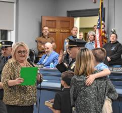 James Fulton is sworn in as a police sergeant at the Township Council meeting Feb. 12. (Photos by Fred Ashplant)