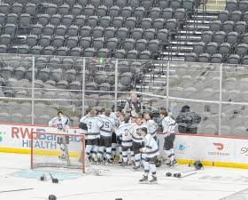 The Kinnelon/Jefferson/Sparta ice hockey team celebrates its win in the NJSIAA Public Co-Op Tournament final Monday, March 10 at the Prudential Center in Newark. (Photos by Aidan Mastandrea)