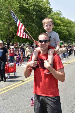 WMP4 Patrick Davie, 2, sits on the shoulders of his father, Kevin.