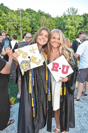 Graduates Avery Vacca, left, and Shelby Durant celebrate after the ceremony.