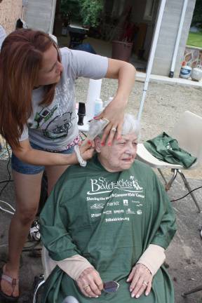 Nothing holds back a great-grandmother's love. Florence Klein, age 95, didn't get a buzz cut but rather a trim. She was there to help raise funds and honor her great-grandson, Nicholas Hahn, age ten, who is currently undergoing cancer treatment. Photo by Ginny Raue