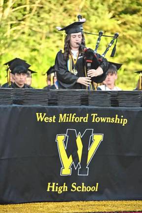 Valedictorian Ava Murphy plays ‘Amazing Grace’ on the bagpipes.