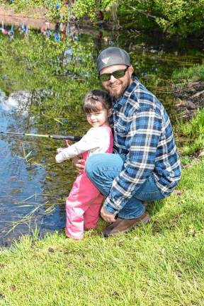 Emily Peterson and her father, Joe, are ready to catch trout.