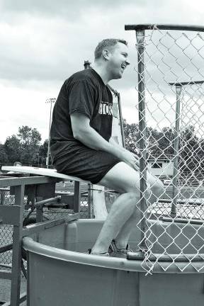 West Milford High School principal, Paul Gorski, is all smiles atop the dunk tank. Photo by Ginny Raue