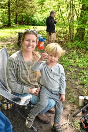 Amanda Poat with her son Quinn, who shows off a worm.