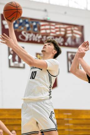 Ognjen Ljusic of West Milford converts a layup for his Highlanders team against Wayne Hills.