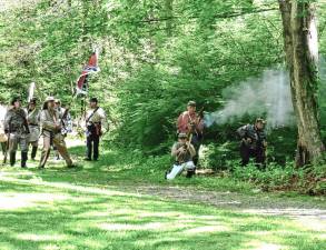 The Confederates attack during a battle re-enactment at the Civil War Weekend on June 8-9 at Long Pond Ironworks in Hewitt. (Photo by Fred Ashplant)