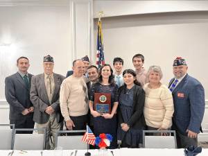 Nicole Petrosillo, center, is named 2024-25 State Teacher of the Year, Grades 9-12, by the Department of New Jersey’s Veterans of Foreign Wars at a ceremony Feb. 8 in Toms River. (Photos provided)