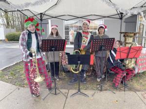 Members of the West Milford Highlander Band performed outside a number of businesses Dec. 3 for the annual Tag Day event. (Photos provided)