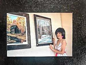 Artist Barbara Welti Van Der Sluys in 1989 exhibits some of her oil paintings of the North Jersey area. (File photo by Ann Genader)