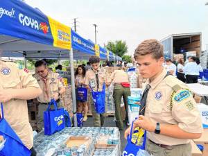 SC1 Scouts with Troop 159 in Hewitt fill bags at Goya Foods’ headquarters in Jersey City. (Photos provided)