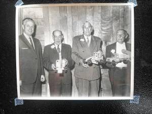 Mayor Wilbur Fredericks with retiring Road Department employees at their retirement party 60 years ago at Pine Village Grove in Oak Ridge. From left are Fredericks, Theodore Sisco, Thomas Cahill and Clarence Bossard. (File photos by Ann Genader)