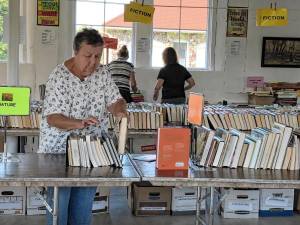 Lorraine Gastrock of West Milford sorts books Wednesday, Sept. 4 for the Friends of the West Milford Township Library’s annual book sale Sept. 13-15 at Wallisch Homestead, 65 Lincoln Ave. (Photos by Kathy Shwiff)