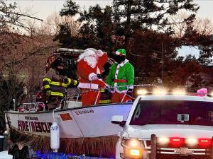 Members of Upper Greenwood Lake Fire Company 5 escort Santa and his helpers through the area Sunday, Dec. 22. (Photo by Denise von Wilke)