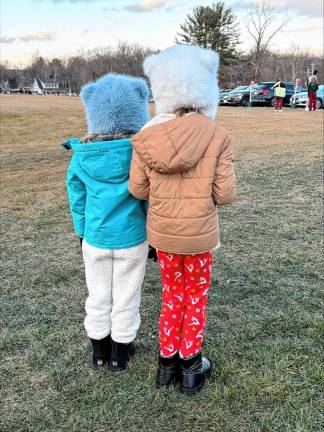 Hope Gallione and Valentina Trevallyn-Jones, both of West Milford, wait for Santa to arrive.