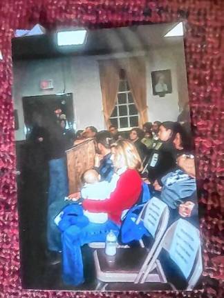 Lyzabeth Glick holds her baby, Emerson, at a memorial ceremony at West Milford Town Hall shortly after the Sept. 11, 2001, terrorist attacks. Her husband, Jeremy, died on United Airlines Flight 93. (Photo courtesy of Ann Genader)