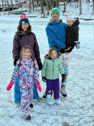 The Jones family ice skates Monday, Jan. 20 in Upper Greenwood Lake. Ben and Lauren Jones with their children, Willa, 6; Winter, 5; and Waverly, 2.