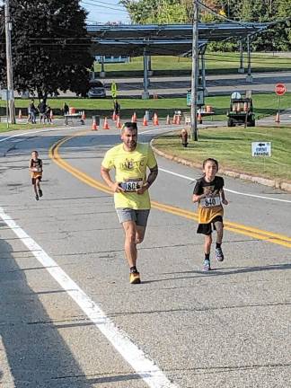 Boy wins 5K benefiting schools