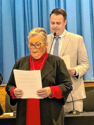 Teresa Dwyer takes the oath for another term.