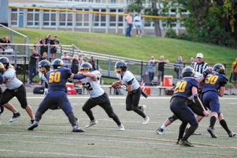 <b>WJ1 West Milford quarterback Aydin Deane is on the move in the first half of the game at Jefferson on Friday, Sept. 6. He passed for 177 yards and rushed for three touchdowns. The Highlanders won, 42-15. (Photos by George Leroy Hunter)</b>