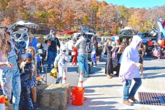 Children collect candy at the Trunk or Treat on Sunday, Oct. 20 in the Upper Greenwood Lake clubhouse parking lot. (Photo by Fred Ashplant)