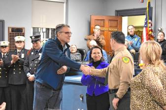 Assemblyman Christian Barranco and Assemblywoman Aura Dunn, both R-25, thank Christopher Franek, assistant division firewarden with the New Jersey Forest Fire Service. He was the incident commander during the Jennings Creek wildfires last fall. (Photos by Fred Ashplant)