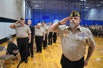Rudy Hass, right, commander of Veterans of Foreign Wars Post 7198, leads the salute during the remembrance for those lost in service to a grateful nation Monday, May 27. (Photo by Rich Adamonis)