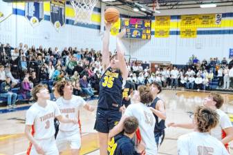 Jefferson's John Campbell leaps high during a shot in the second quarter of the game against Hackettstown on Jan. 10. The Falcons lost, 57-52. (Photos by George Leroy Hunter)