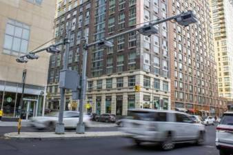 <b>Toll traffic cameras hang above West End Avenue near 61st Street in Manhattan. (File photo by Ted Shaffrey/AP)</b>