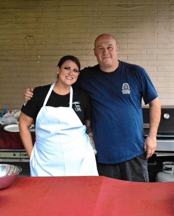 Jill Irven, an Elks volunteer cook, and Exalted Ruler of Elks Lodge #2236 Kevin Goodsir man the grill.