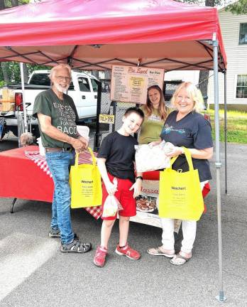 Don and Pat Wright of West Milford with their grandson pick up pizza from Pie-Eyed Pizza.