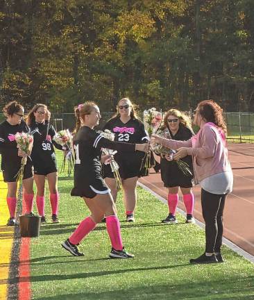 Team honors breast cancer survivors