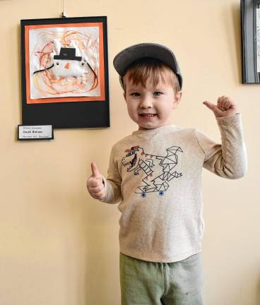 Marshall Hill preschool student Jacob Batson with his ‘Melted Snowman,’ which is on display with other student art through March at the West Milford Public Library. (Photo by Rich Adamonis)