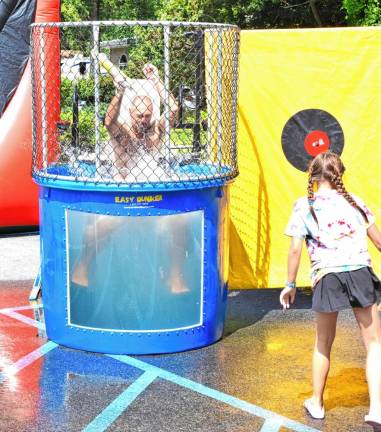 Tony Giannantonio, vice president of the Upper Greenwood Lake Property Owners Association, is dunked during UGL Day on Saturday, Aug. 24. (Photo by Fred Ashplant)