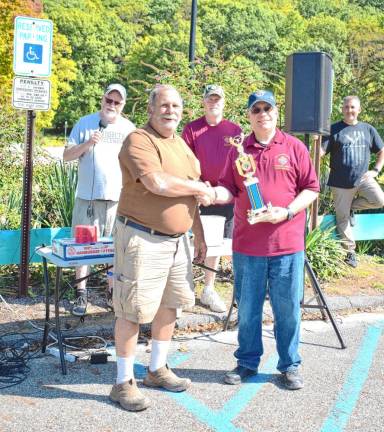 Joe Ragonese accepts a trophy for Best Muscle Car.