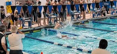 PC1 Michael DeMarco of West Milford slaps the pool after a closely contested race in the 400 freestyle relay at the Passaic County Coaches Association meet. He swims for Passaic County Technical Institute, which won its 10th consecutive county title. (Photo provided)