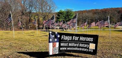 FL1 The West Milford PBA Local 162 honors township residents killed in action by participating in the West Milford Rotary Club’s Flags for Heroes project. (Photo by Rich Adamonis)