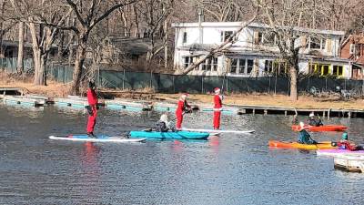 Paddleboarders and kayakers take part in the 11th annual Santapalooza on Greenwood Lake on Saturday, Dec. 7. (Photos by Kathy Shwiff)