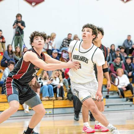 Landon MacKenzie of West Milford battles with Brooklyn Jenlinsky of Wayne Hills for a rebound on a second-half West Milford free throw.