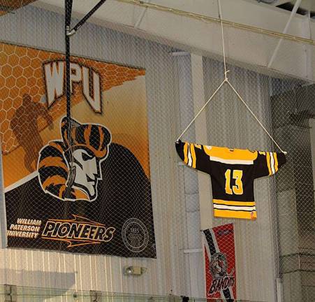 Brian Parrello&#146;s #13 jersey is lifted to the rafters.
