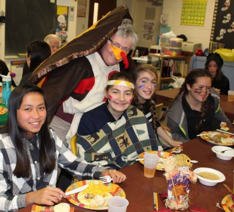 Principal Furrey spends some time with her eighth graders at the Thanksgiving celebration.