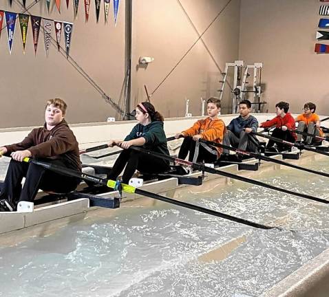 Winter training in indoor rowing tanks. From left are Logan Down, Mae Beskin-Lott, Gavin Stekelenburg, Yair Blekher, Edward Klikfeld and Ethan Nir.