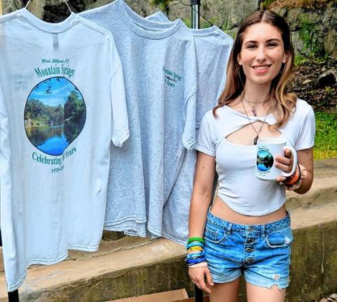 Jessica Edigio, an award-winning artist, designed the centennial logo. Her mother, Donna, was the lead organizer of the picnic celebrating 100 years since Mountain Srpings’ founding.