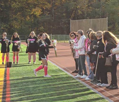 Team honors breast cancer survivors