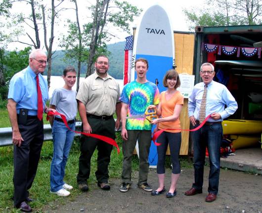 Photo by Roger Gavan On July 9, government and business representatives joined owners Chaz Corallo and Theresa Sparkes for the grand reopening of Greenwood Lake Paddleboards at its new location at Monksville's South Launch. From left, Ringwood Mayor Walter Davison, Ringwood Chamber of Commerce Vice President of Membership Patti Hoffmann, Ringwood State Park Superintendent Eric Pain, owners Chaz Corallo and Theresa Sparkes and Michael Johndrow, executive director of the Warwick Valley Chamber of Commerce.