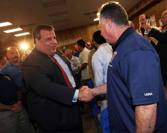 Photo from www.state.nj.us/(Governor's Office/Tim Larsen) Governor Chris Christie shakes hands with union members before speaking at the Union Hall Meeting for the Building and Construction Trades Council in Perth Amboy on Wednesday, Oct. 3, 2012.